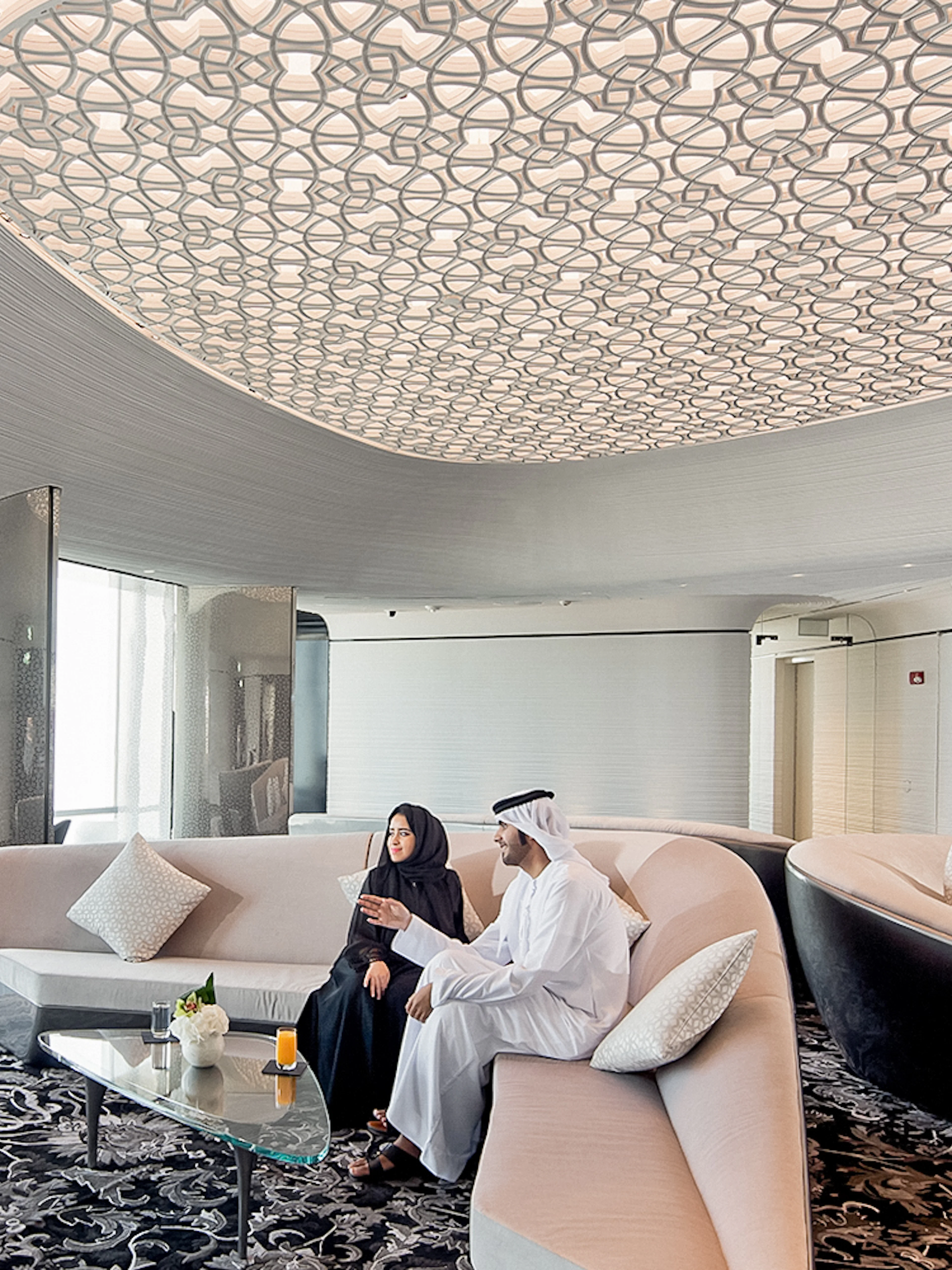 People relaxing with drinks at the lounge on level 148, Burj Khalifa, Dubai.