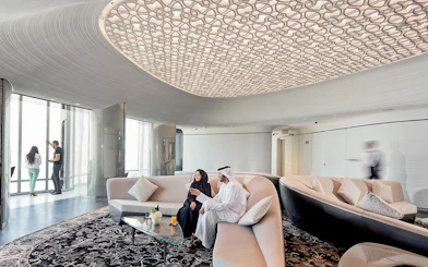 People relaxing with drinks at the lounge on level 148, Burj Khalifa, Dubai.