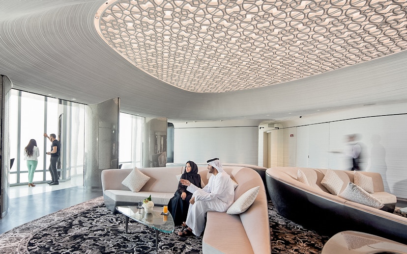 People relaxing with drinks at the lounge on level 148, Burj Khalifa, Dubai.