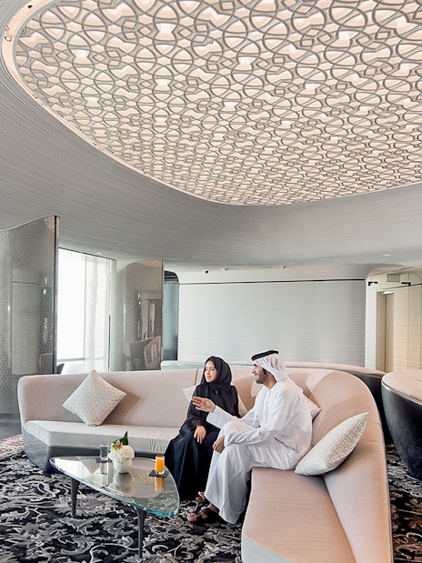 People relaxing with drinks at the lounge on level 148, Burj Khalifa, Dubai.