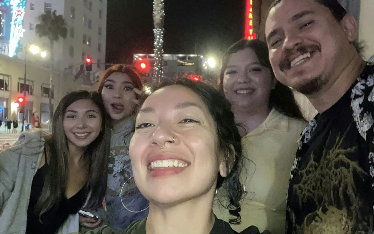 Group enjoying Hollywood nightlife during Ghosts of Hollywood self-guided city exploration game.