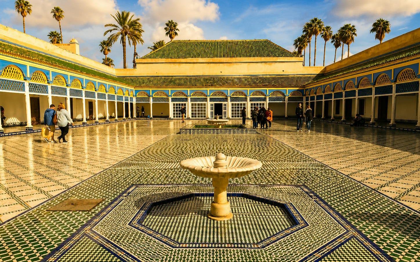 Bahia Palace courtyard with fountain and mosaic tiles, Marrakech tour.