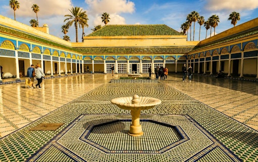 Bahia Palace courtyard with fountain and mosaic tiles, Marrakech tour.