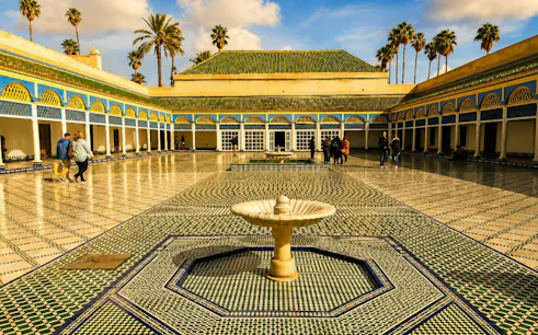 Bahia Palace courtyard with fountain and mosaic tiles, Marrakech tour.