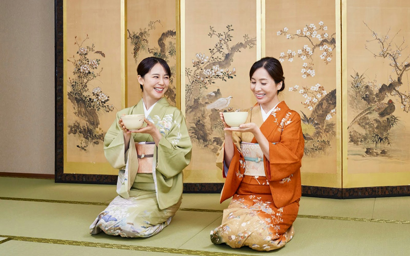 Two women in kimonos participating in a traditional tea ceremony in Tokyo Maikoya.