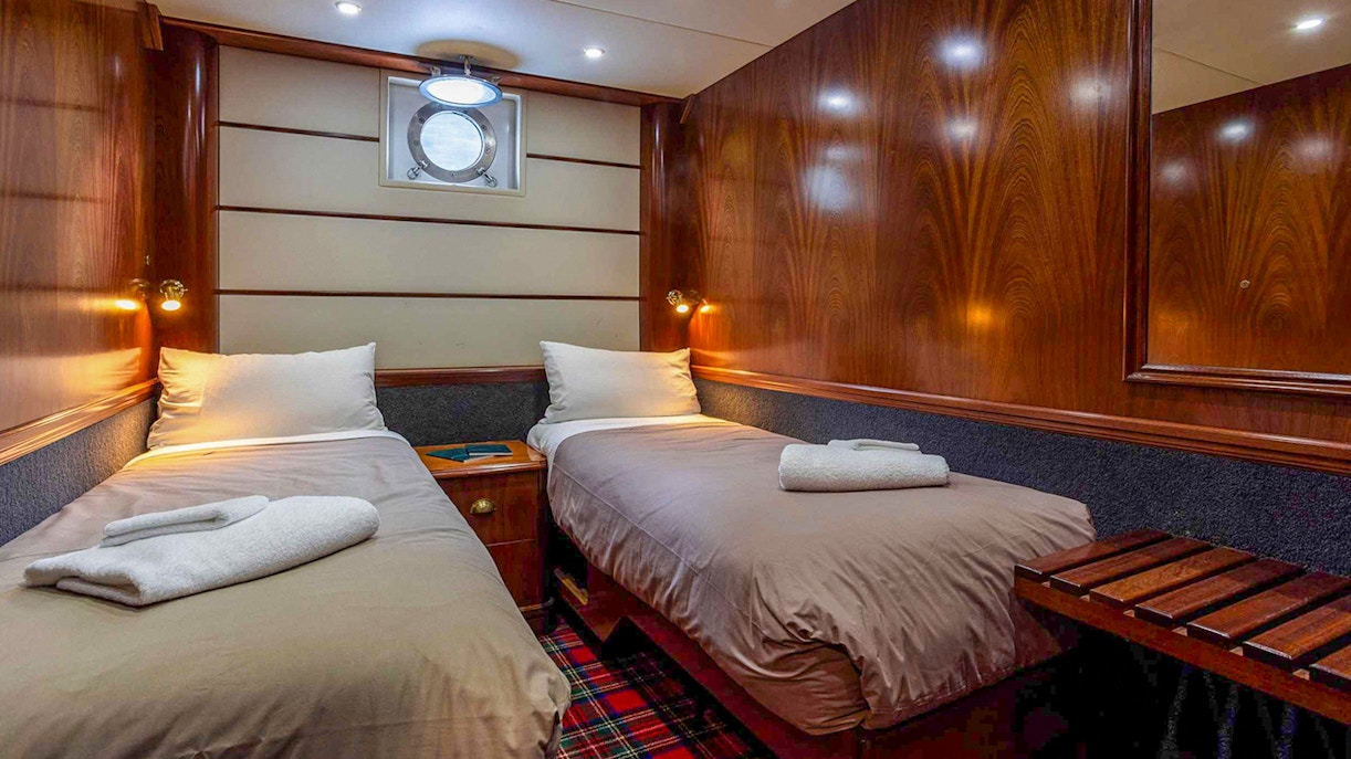 Doubtful Sound fjord view from cruise ship deck, Te Anau overnight tour.