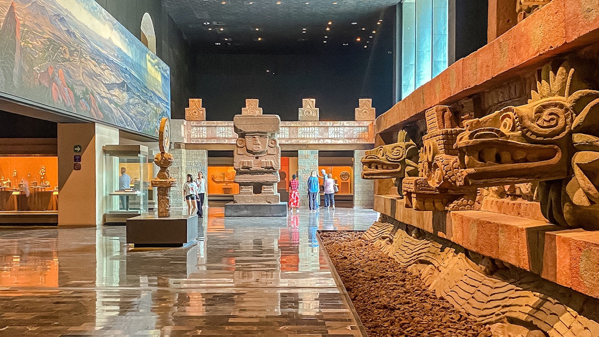 Visitors exploring exhibits at the Anthropology Museum in Mexico City.