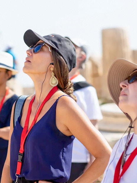 Guests using audio guides during Acropolis Parthenon tour in Athens.