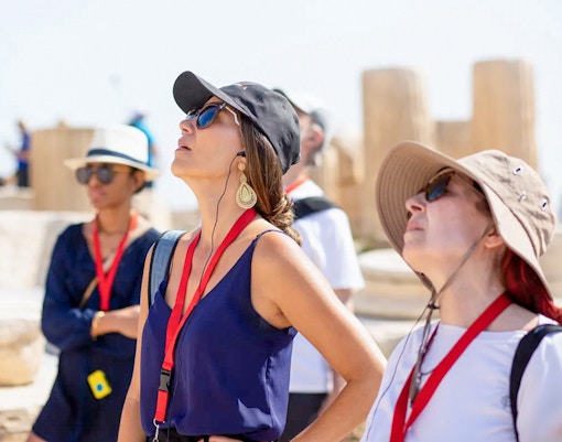 Visitor using audio guide at Acropolis Parthenon, Athens, Greece.
