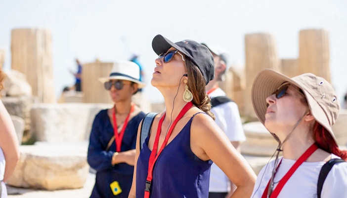 Visitor using audio guide at Acropolis Parthenon, Athens, Greece.