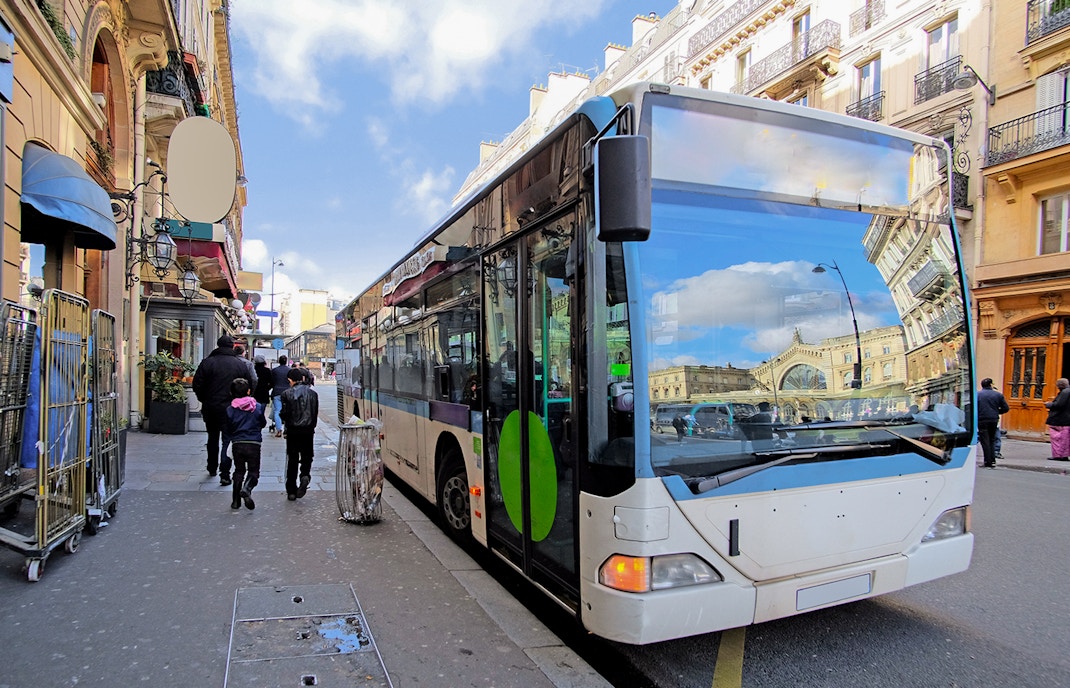Paris public transport bus on city street.