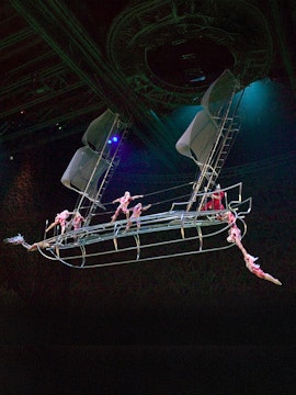Acrobats performing on a suspended ship in a Las Vegas show.