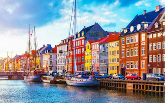 Colorful buildings along Nyhavn canal with boats, Copenhagen, part of the Time Travelers Cronophone game.