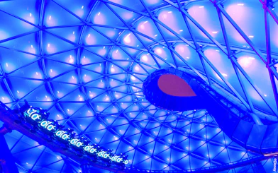 TRON Lightcycle Power Run illuminated canopy with futuristic design.