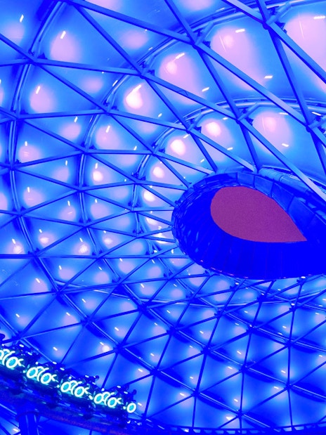 TRON Lightcycle Power Run illuminated canopy with futuristic design.