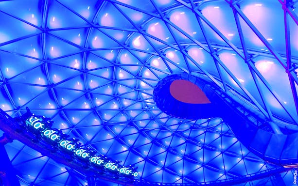 TRON Lightcycle Power Run illuminated canopy with futuristic design.