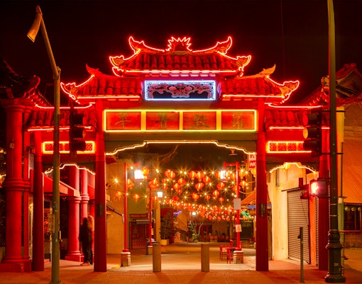 Chinatown gate illuminated with holiday lights, Los Angeles Big Bus tour.