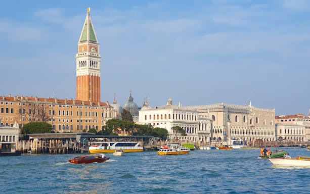 Rialto to Punta della Dogana tour view of Venice's Grand Canal with St. Mark's Campanile.