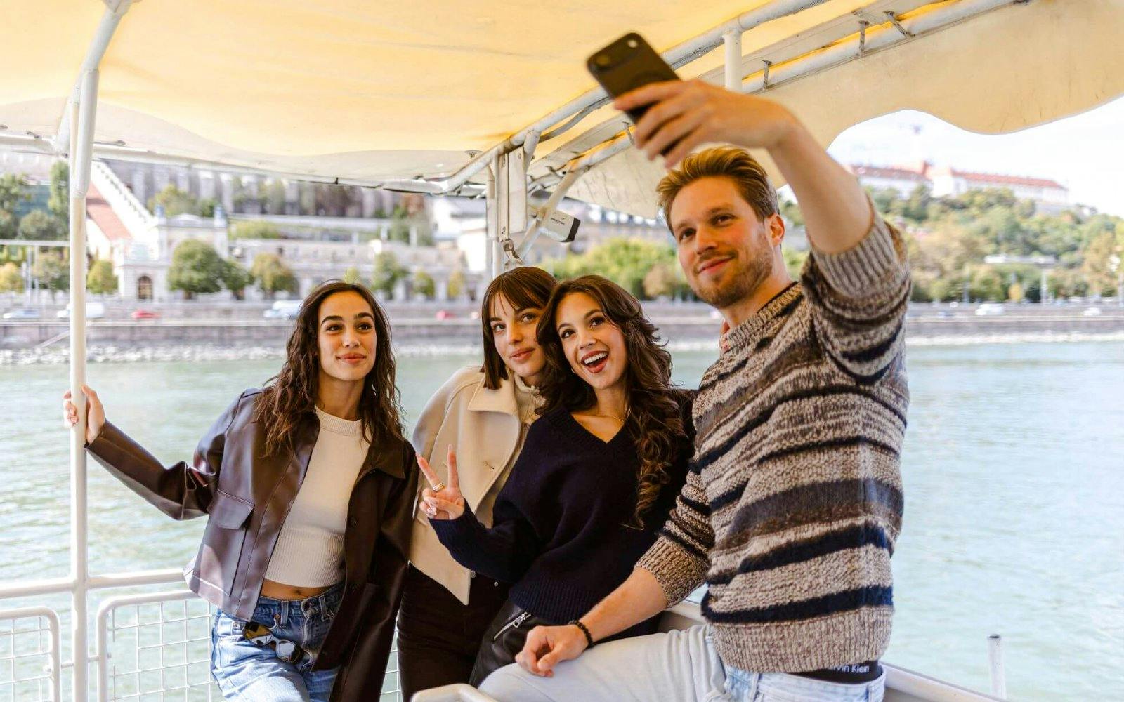 Guests taking a selfie on the Budapest Highlights River Cruise on the Danube.