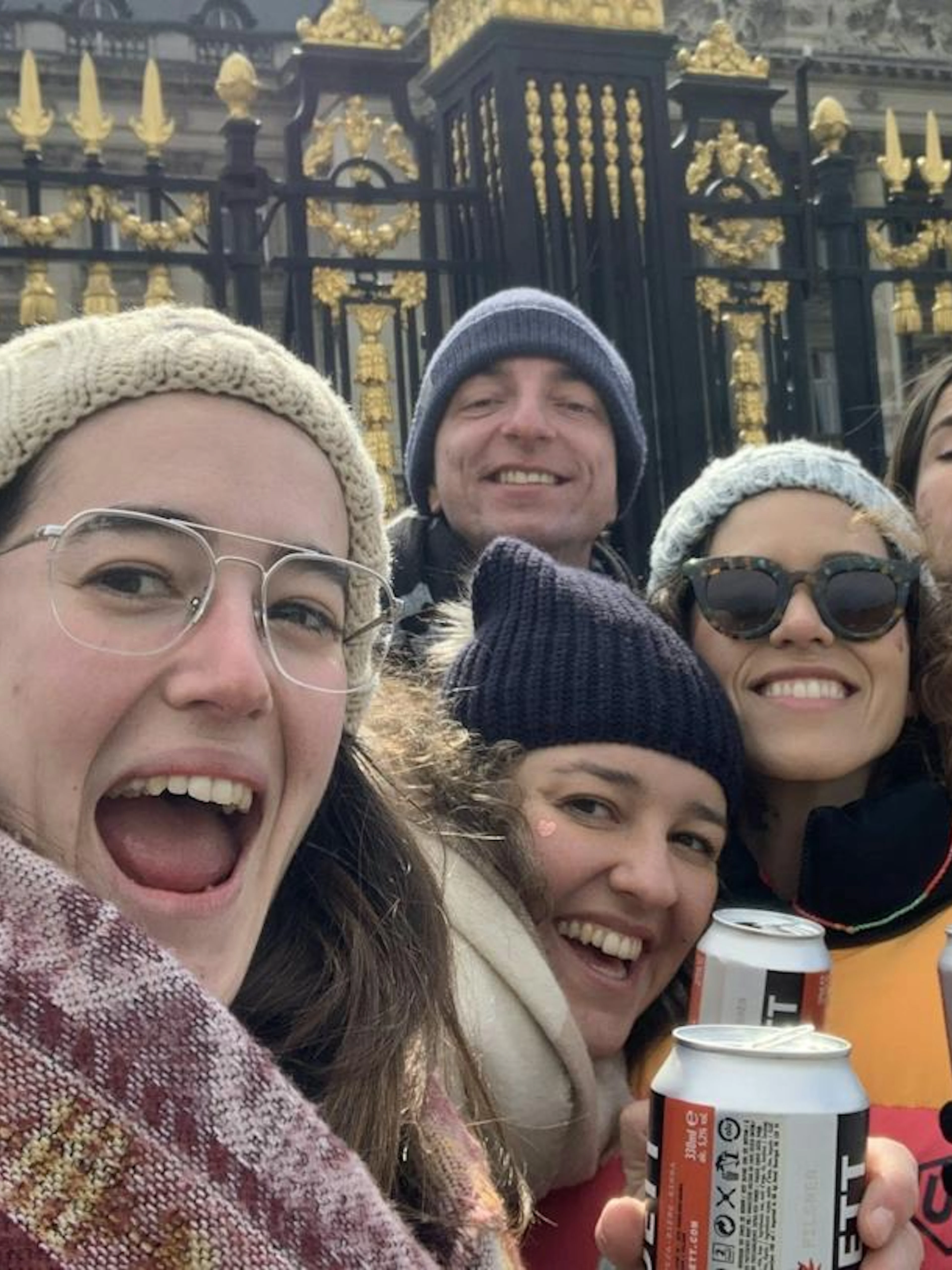 Group enjoying Brussels Dutchman's Gold Treasure Hunt near ornate gate.