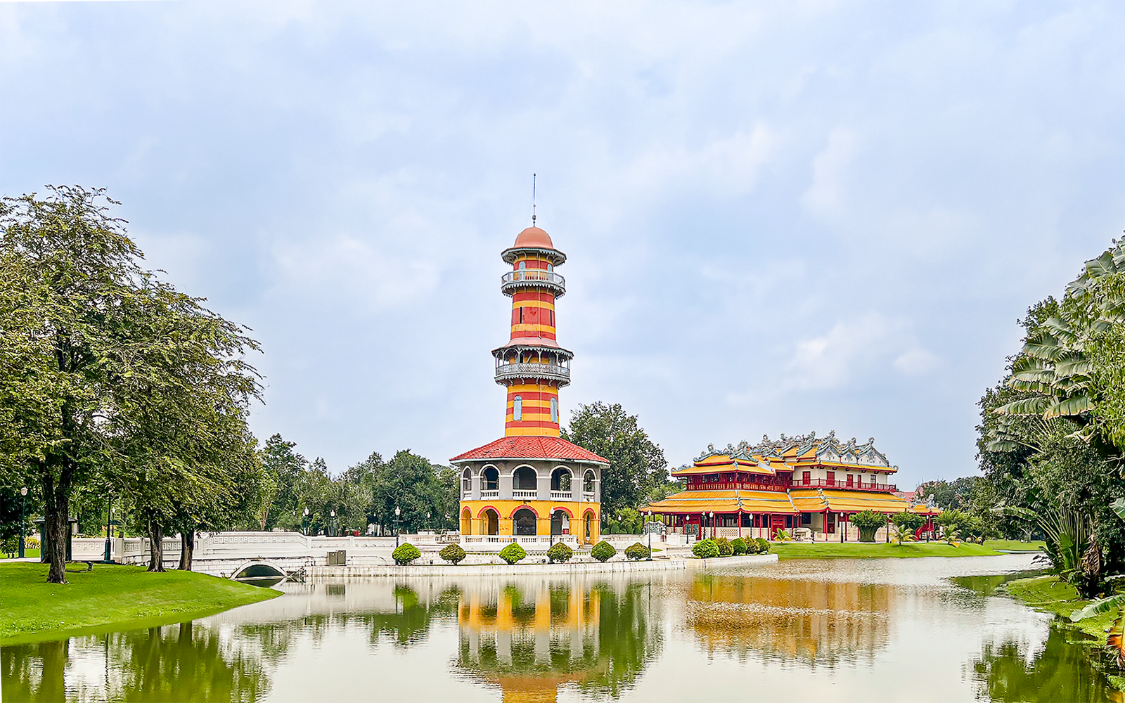 Bang Pa-In Palace with colorful tower and pavilion by a lake, Ayutthaya, Thailand.