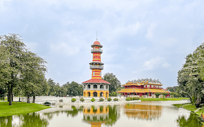 Bang Pa-In Palace with colorful tower and pavilion by a lake, Ayutthaya, Thailand.