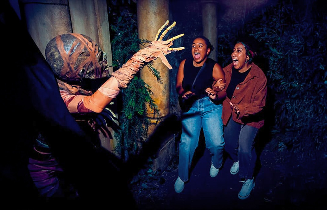 Guests react to a costumed performer