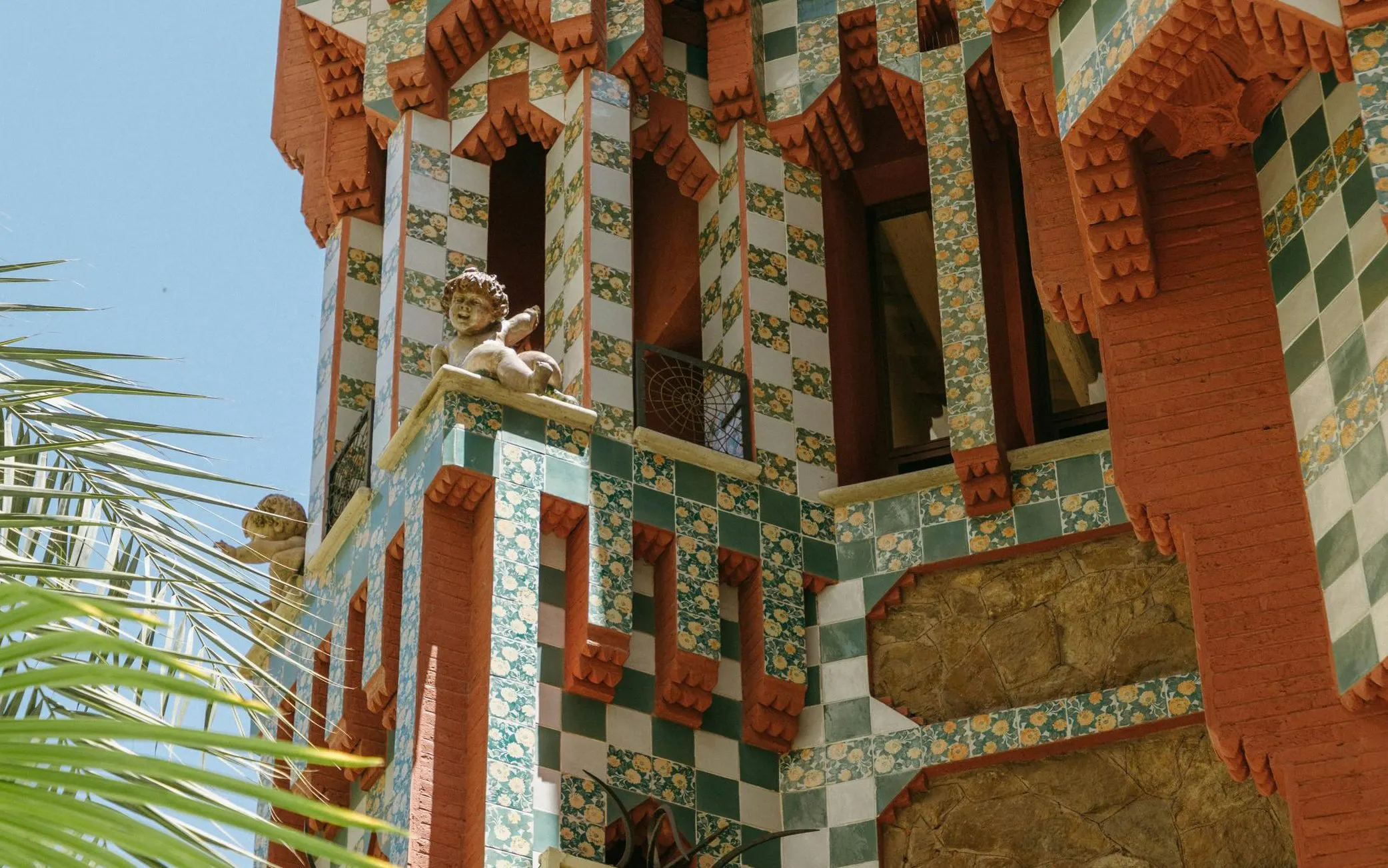 Casa Vicens facade with colorful tiles and decorative sculptures in Barcelona.