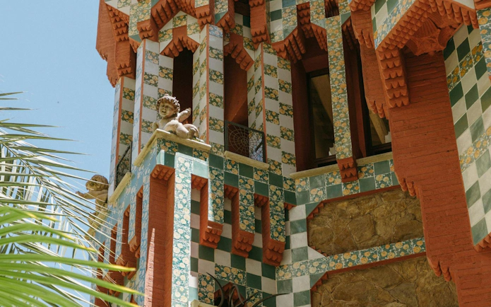 Casa Vicens facade with colorful tiles and decorative sculptures in Barcelona.