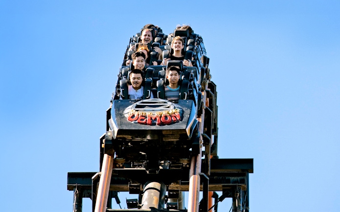 Riders on the Demon rollercoaster at California's Great America, Six Flags.