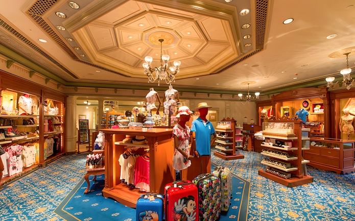 Gift shop interior at Disneyland Hong Kong with Disney-themed merchandise and souvenirs.