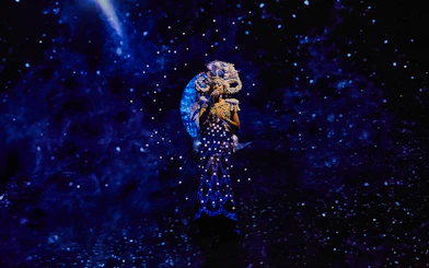 Performer in illuminated costume during Michael Jackson ONE show.