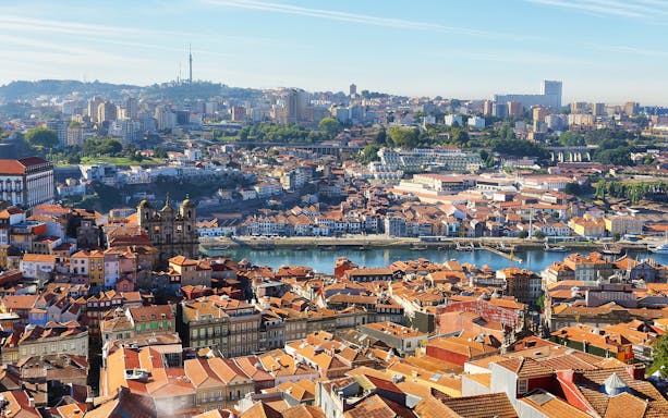 Aerial view of Porto cityscape with Clerigos Tower and Douro River.