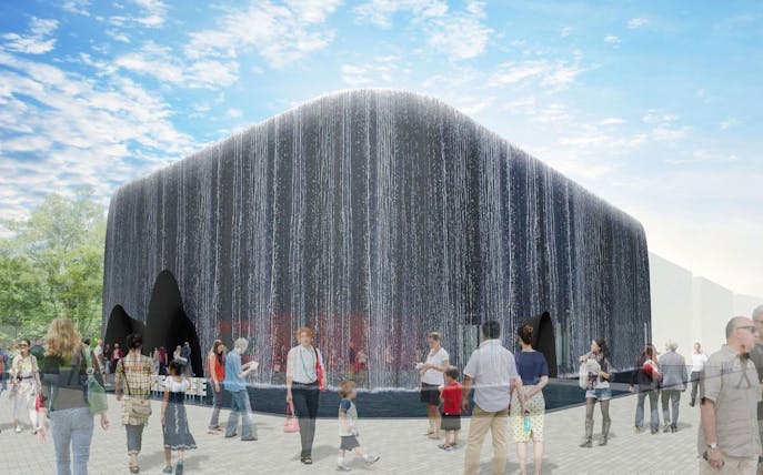 Visitors at the "Future of Life" Pavilion, Expo 2025 Osaka, with cascading water facade.
