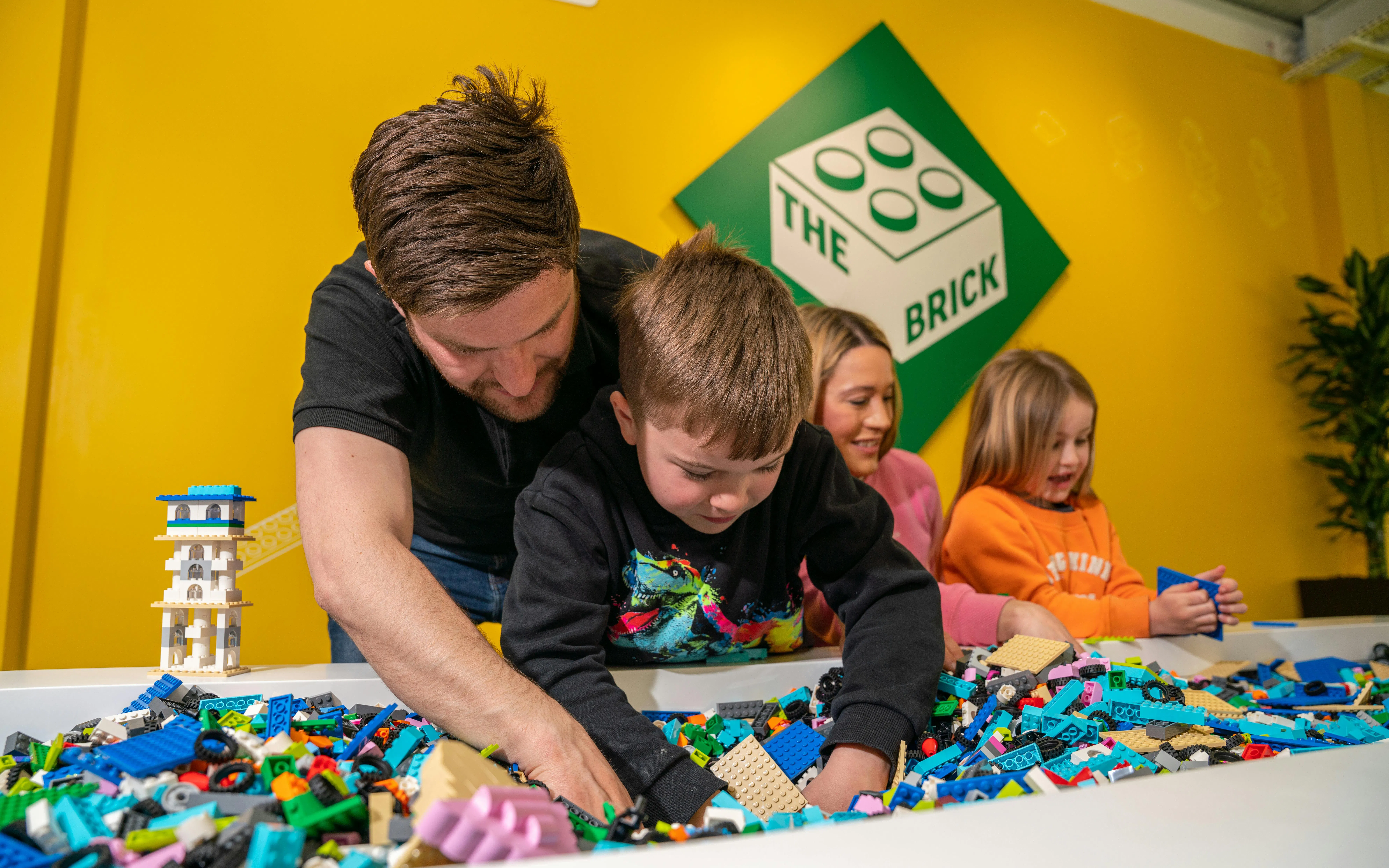 Children building with LEGO bricks at Legoland Windsor.