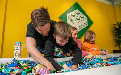 Children building with LEGO bricks at Legoland Windsor.