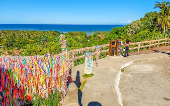 Colorful ribbons on a viewpoint overlooking the ocean in Arraial d'Ajuda, Porto Seguro.