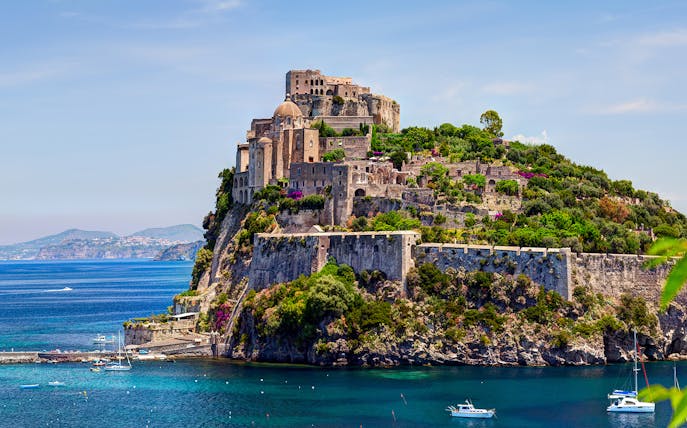 Castle on a cliff overlooking the sea in Naples, Italy.
