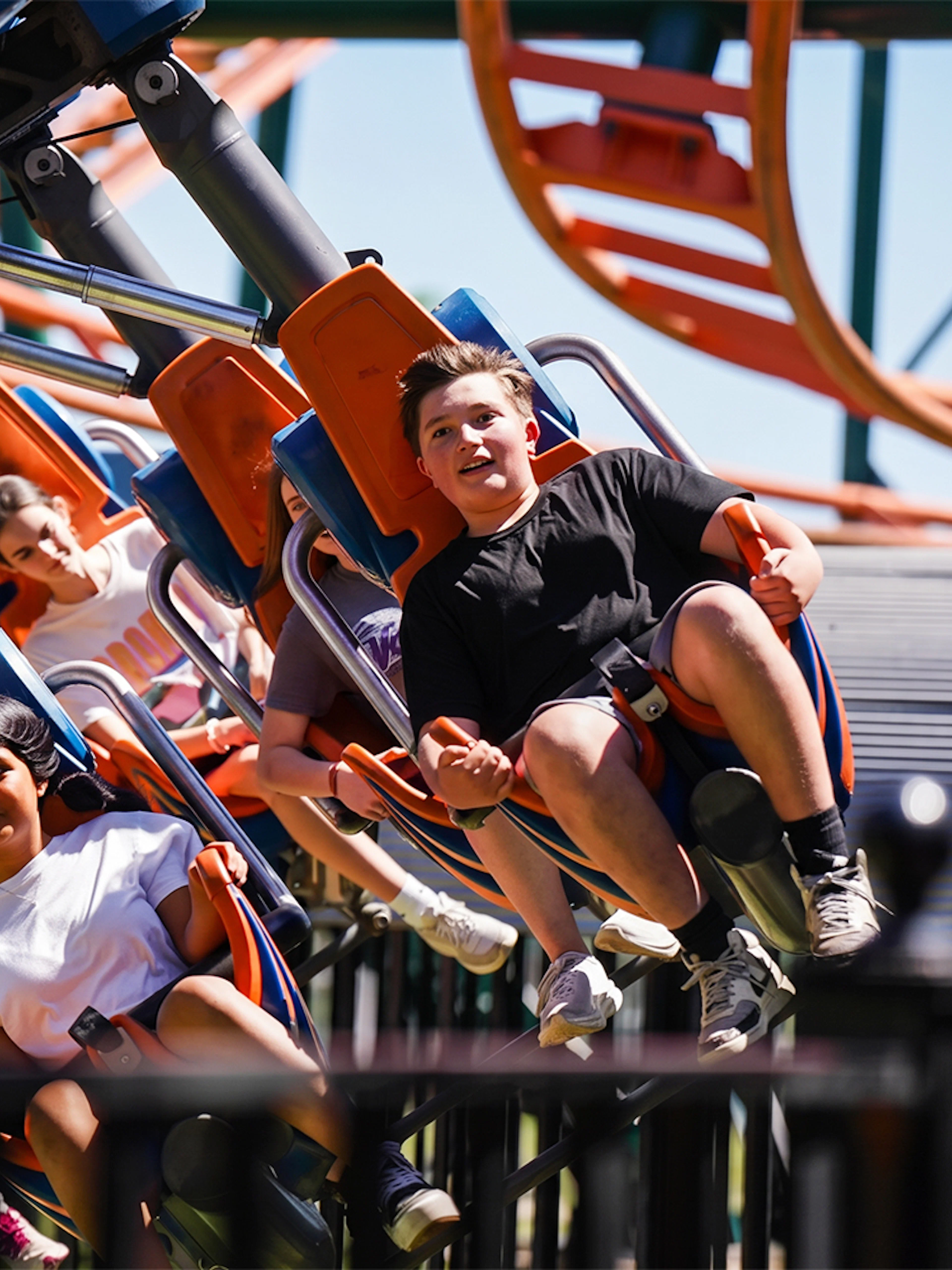 Riders enjoying the Steel Lasso roller coaster at Frontier City.