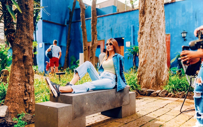 Visitors relaxing in the garden of the Frida Kahlo Museum, Mexico City.