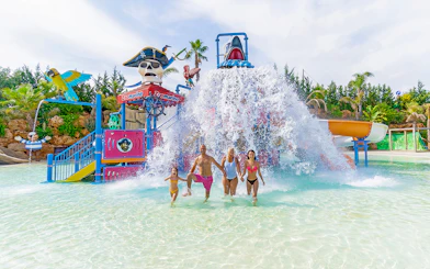 Family enjoying water play area at Zoomarine Portugal.
