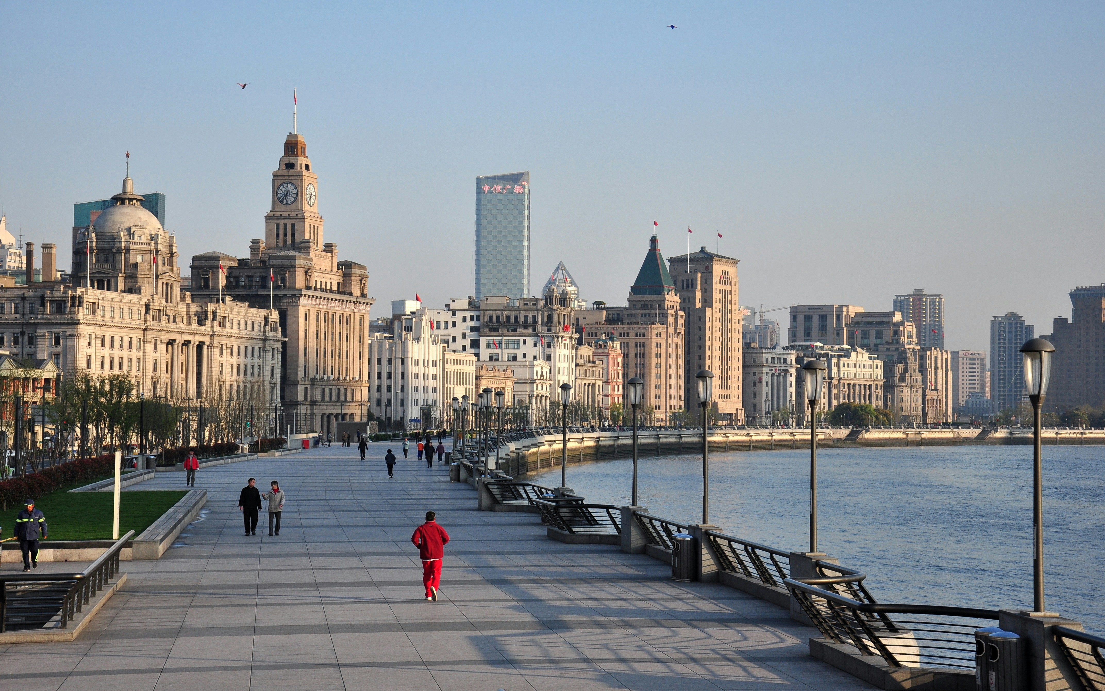 Promenade along the Bund with historic buildings in Shanghai, China.