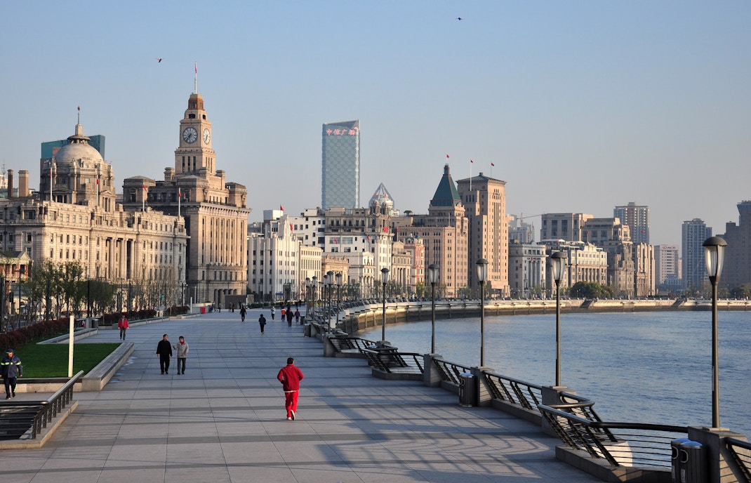Promenade along the Bund with historic buildings in Shanghai, China.