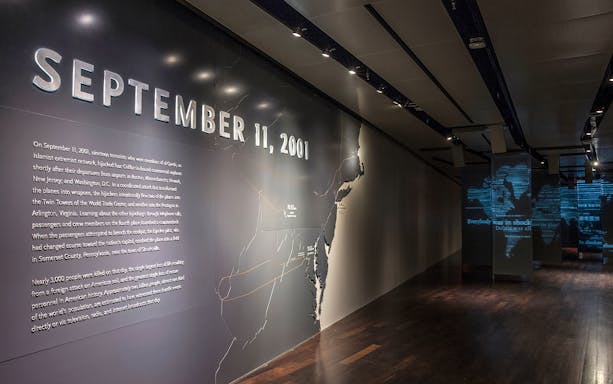 9/11 Museum exhibit with September 11, 2001 text and map display.