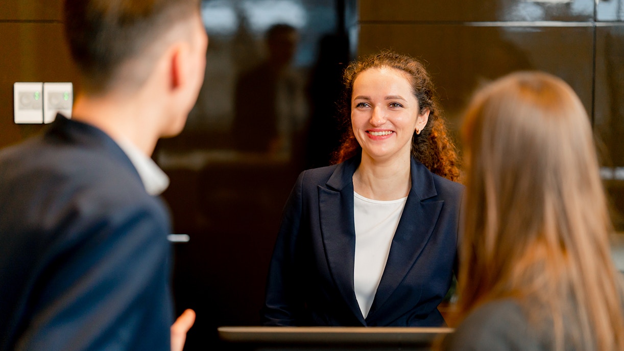 Reception area of a luxury hotel in Paris with elegant decor and a welcoming atmosphere.