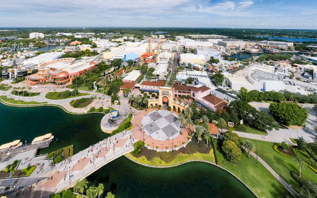 Aerial view of Universal Orlando with theme park attractions and surrounding landscape.