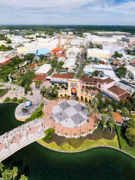 Aerial view of Universal Orlando with theme park attractions and surrounding landscape.