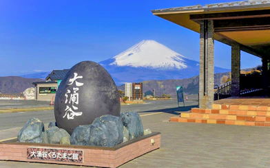 Owakudani black egg monument with Mount Fuji in the background, Hakone, Japan.