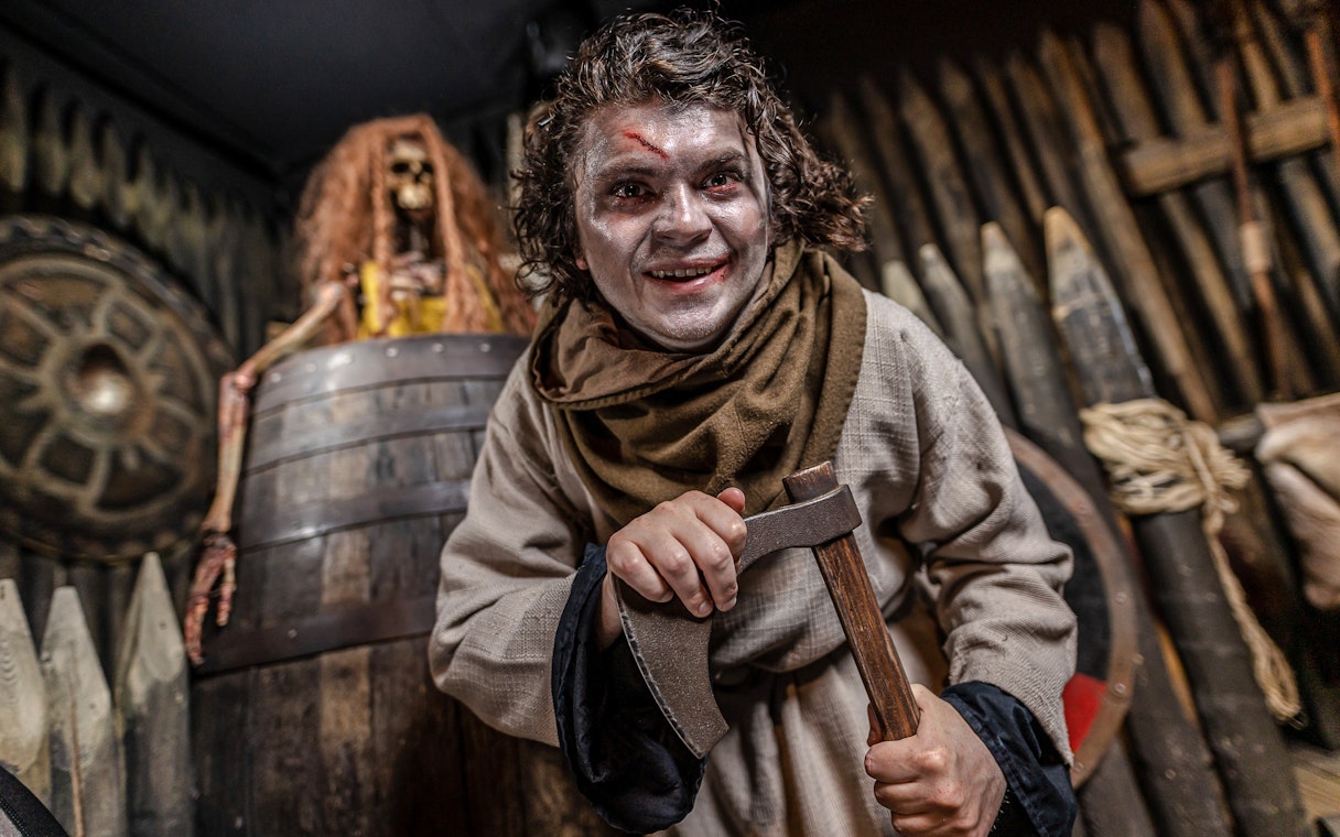 Viking actor with axe at York Dungeon's Vengeance of the Vikings exhibit.