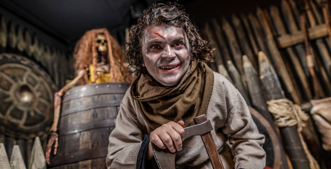 Viking actor with axe at York Dungeon's Vengeance of the Vikings exhibit.